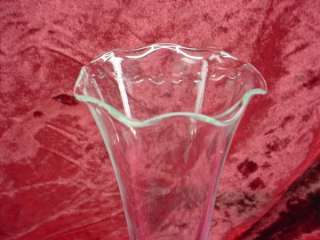 Up forone low price is a lovely glass trumpet vase created in the WWII 