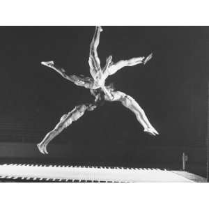 Multiple Exposure Shot of a Gymnast Jumping on a Trampoline 