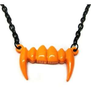    Neon Orange Dracula Fang Vampire Teeth Necklace Toys & Games