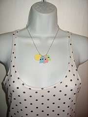 Cool Pacman necklace Yellow pacman with a blue, pink and green 