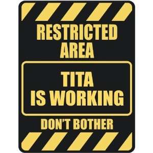   RESTRICTED AREA TITA IS WORKING  PARKING SIGN