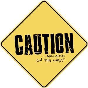   CAUTION  MCLEOD ON THE WAY  CROSSING SIGN