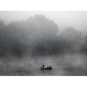 Early Morning Fog Rises off the Susquehanna River as a Lone Fisherman 