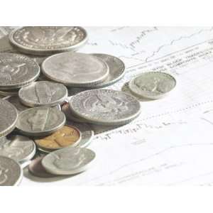  Pile of American Coins on Top of Stock Market Report 