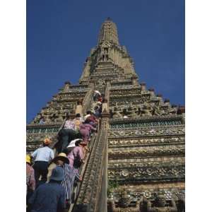  Tourists Climb the Steps of Wat Arun, in Bangkok, Thailand 