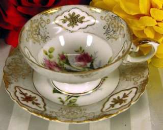   crazing or color loss. There is some gold wear on the cup and saucer