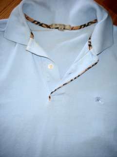 Mens size small light blue Burberry polo shirt with Nova trim. It 