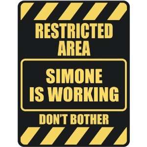   RESTRICTED AREA SIMONE IS WORKING  PARKING SIGN