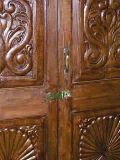   india cabinet this cabinet has two doors that fold to the sides and