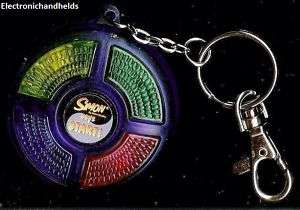 SIMON electronic keychain game by Hasbro. Fully tested, perfect 