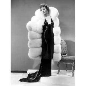 Claudette Colbert, in Travis Banton Gown and White Fox Fur Coat, c 