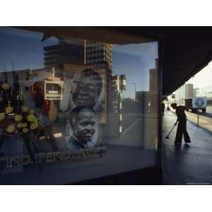  Portraits of Robert Mugabe and Canaan Banana in a Window 