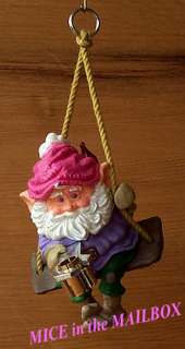   power light ornament dated 1987 finds an elf in hanging chair working