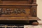 Richly hand carved of solid oak about 1870, this bookcase has 